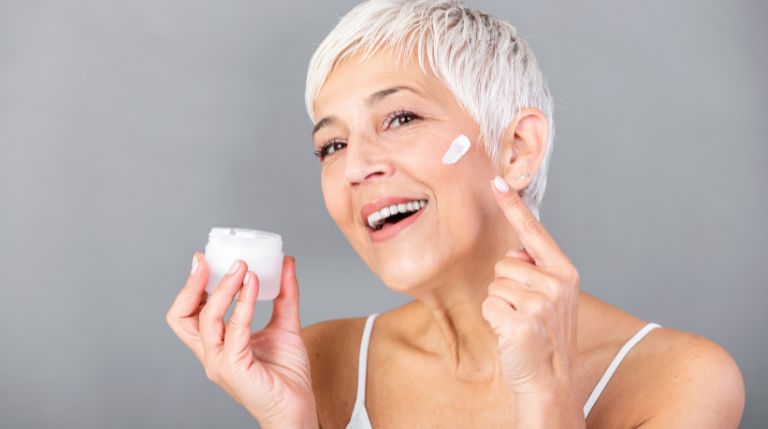 woman putting on medical grade skincare